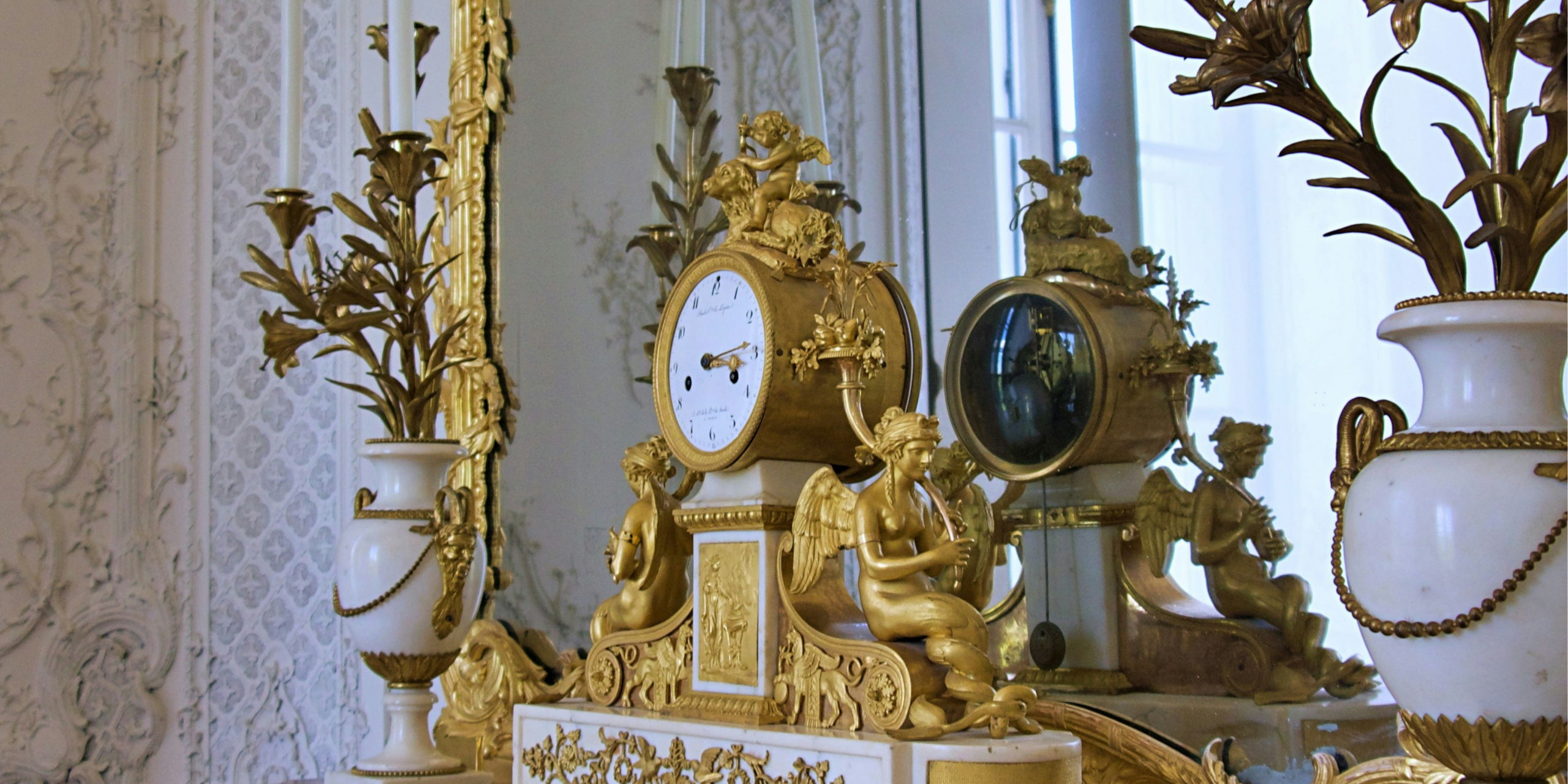 Restauration de dorure Vienne : trumeau et pendule Empire en bronze doré
